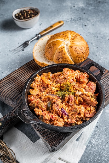 Turkish breakfast with Menemen omelet and bread Dark background Top view