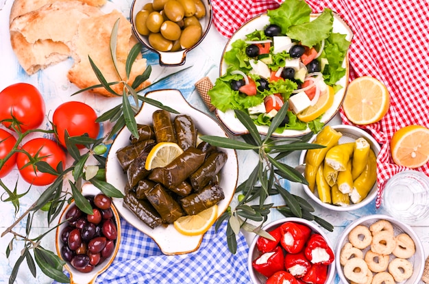 Turkish cabbage rolls and various snacks of national cuisine. Rice in grape leaves and olives. Food for a traditional oriental lunch