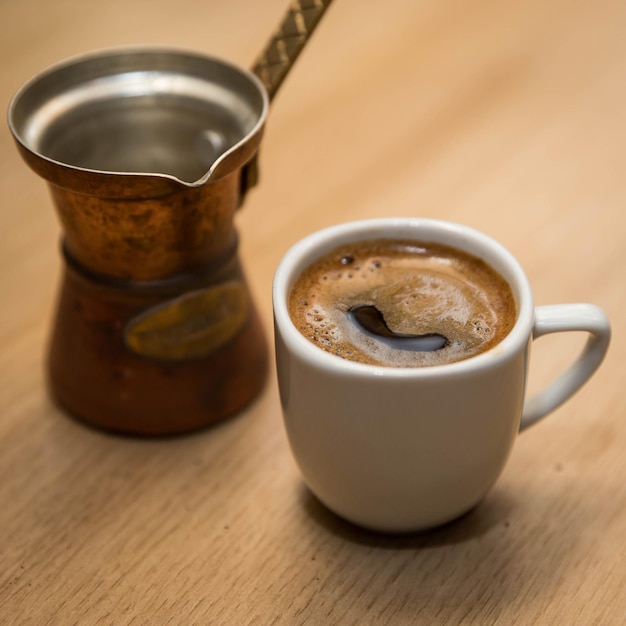 Turkish coffee cooked in the sand making turkish coffee