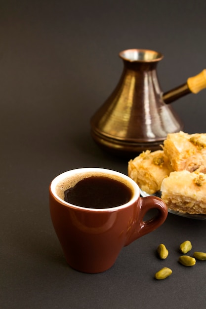 Turkish coffee and delight on the black background