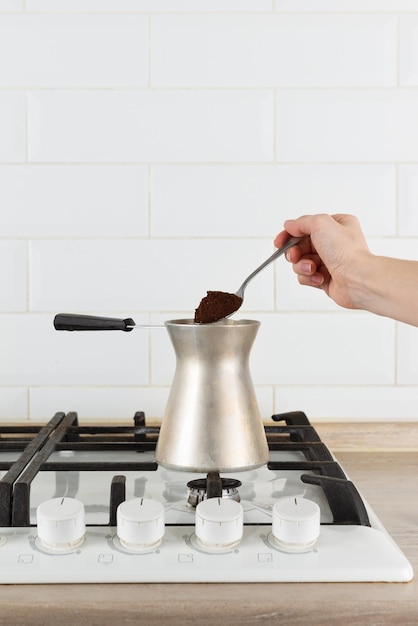 Photo turkish coffee on a gas stove coffee making process