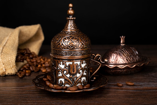 Turkish coffee. Oriental tableware with a pattern. Coffee beans, Turkish delight