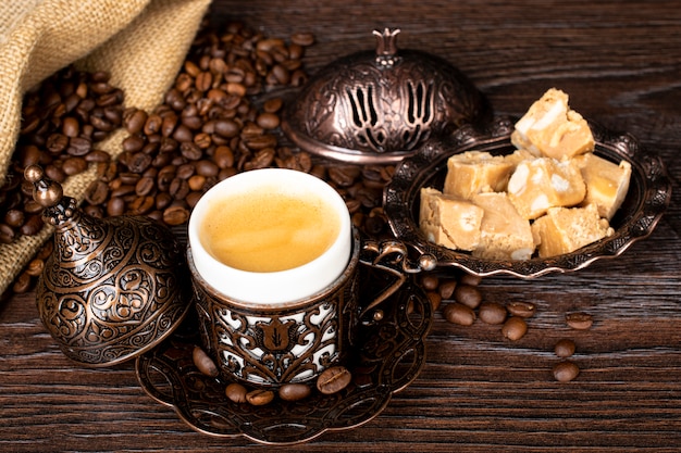 Turkish coffee. oriental tableware with a pattern. coffee\
beans, turkish delight