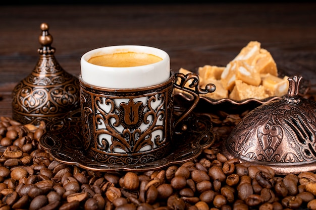 Turkish coffee. oriental tableware with a pattern. coffee\
beans, turkish delight