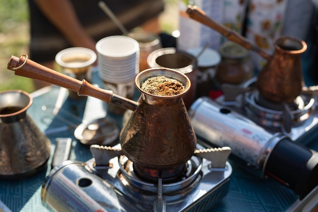 Turkish coffee pot boiling on portable stove