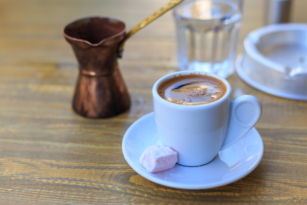 Turkish coffee served on a wooden table