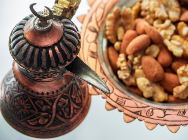 Turkish copper coffee pot handmade with embossing and Turkish candy with a national pattern