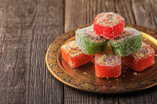 Turkish delight on a dark wooden board