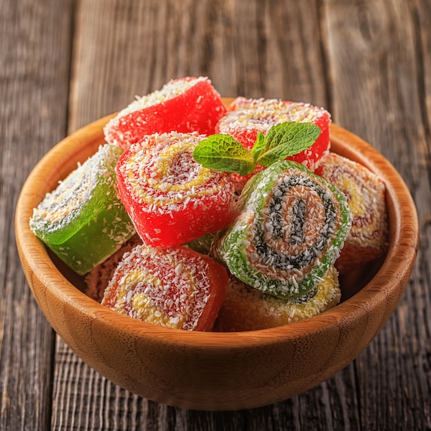 Turkish delight on dark wooden.