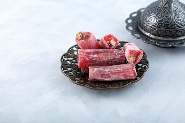 Turkish delight Oriental sweets with mix nuts Marmalade with sweet sour taste rose and pomegranate