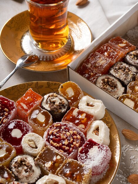 Turkish Delight. view of the tol with a cup of tea and Turkish delight sweets on a plate. A traditional oriental treat is sweetness.