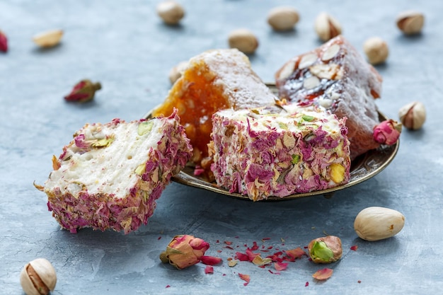 Turkish delight with pink petals and nuts