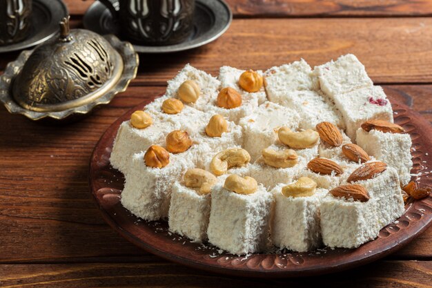 Turkish delight on a wooden table.