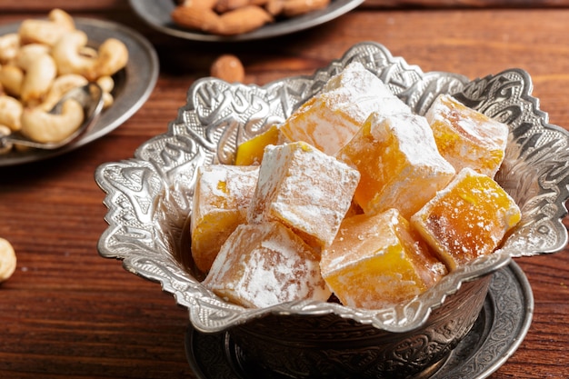 Turkish delight on a wooden table.