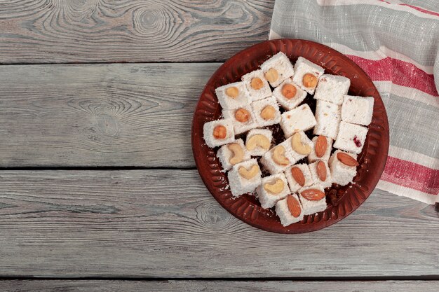 Turkish delight on a wooden table.