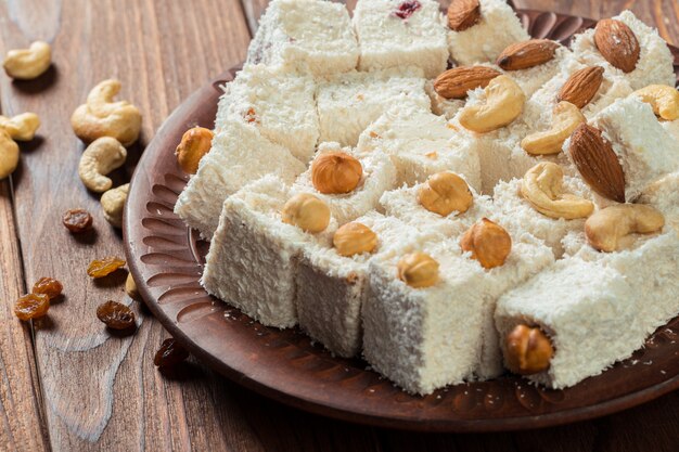 Turkish delight on a wooden table.