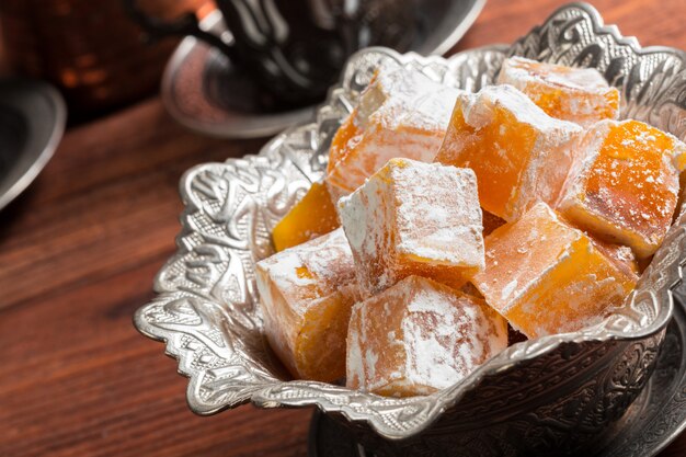 Turkish delight on a wooden table.