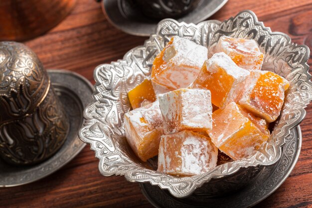 Turkish delights on a wooden table.