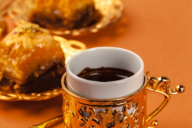 Turkish dessert baklava served on traditional metal tableware