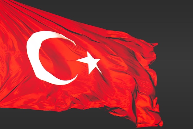 Photo turkish flag on black background a vivid image of the turkish flag in motion with its striking red