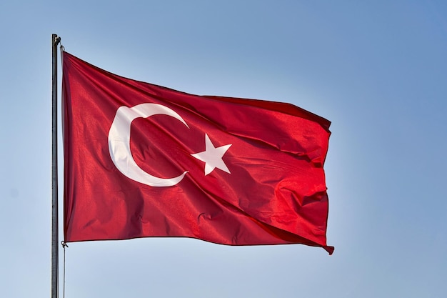 Turkish flag waving in the wind against the background of the sky