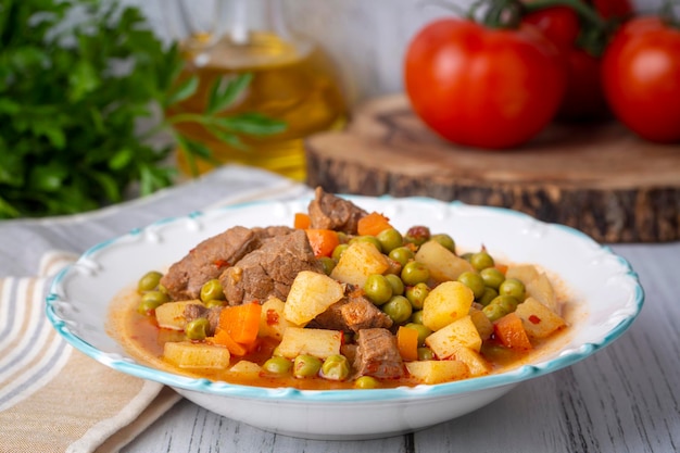 Turkish Food Green Pea Stew with Meatballs - Kofte or Kofta Bezelye. (Turkish name; kofteli bezelye)