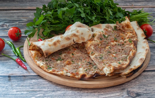 Turkish food: lahmacun, Turkish pizza, ayran, parsley, lemon, tomato.