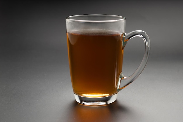 A turkish glass of tea on black background