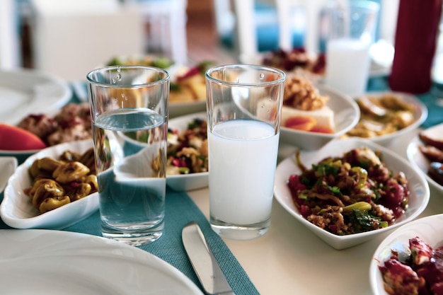 Turkish and Greek Traditional Dinning Table with Special Alcohol Drink Raki Ouzo and Turkish Raki i