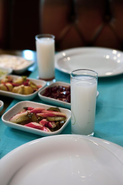 Turkish and Greek Traditional Dinning Table with Special Alcohol Drink Raki Ouzo and Turkish Raki i