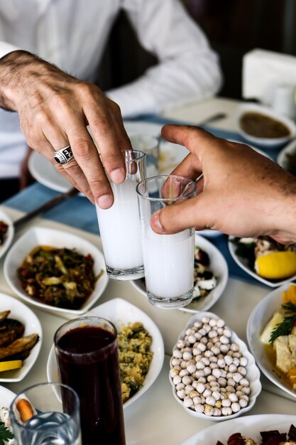 Turkish and Greek Traditional Dinning Table with Special Alcohol Drink Raki Ouzo and Turkish Raki