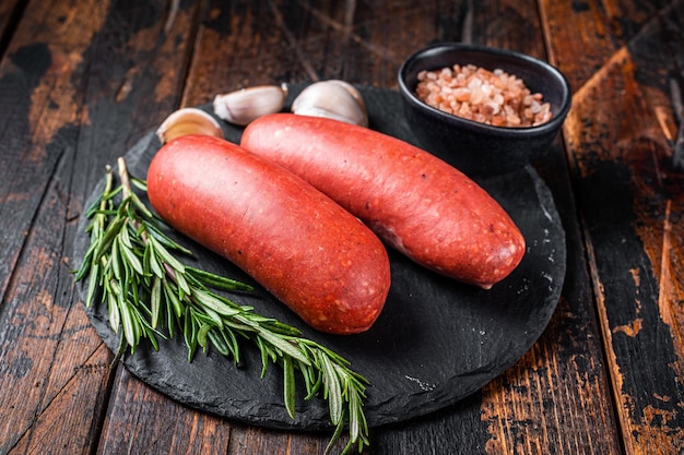 Turkish halal Sucuk meat sausage Wooden background Top view