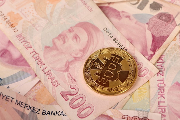 Turkish lira banknotes and bitcoin coin