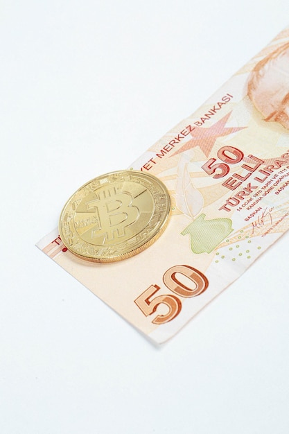 Turkish lira banknotes and bitcoin coin