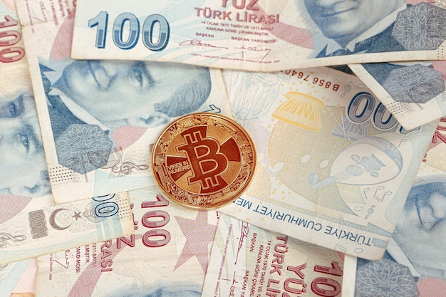 Turkish lira banknotes and bitcoin coin