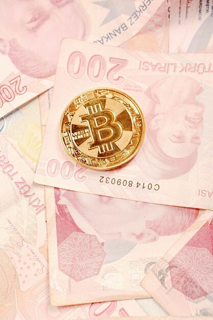 Turkish lira banknotes and bitcoin coin