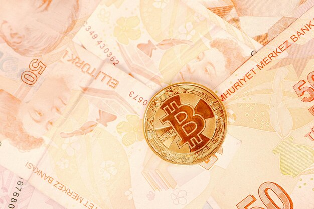 Turkish lira banknotes and bitcoin coin