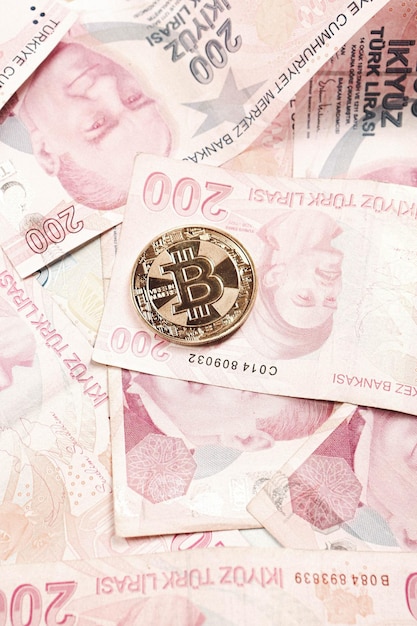 Turkish lira banknotes and bitcoin coin