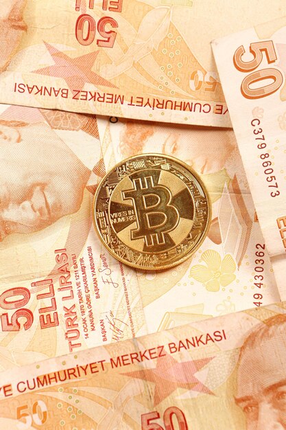 Turkish lira banknotes and bitcoin coin