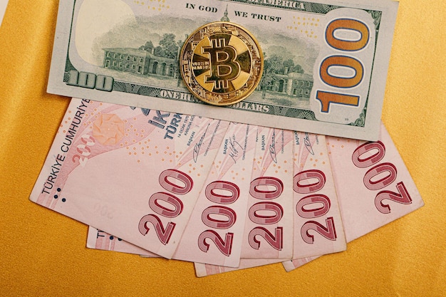 Turkish lira banknotes US Dollars and bitcoin coin