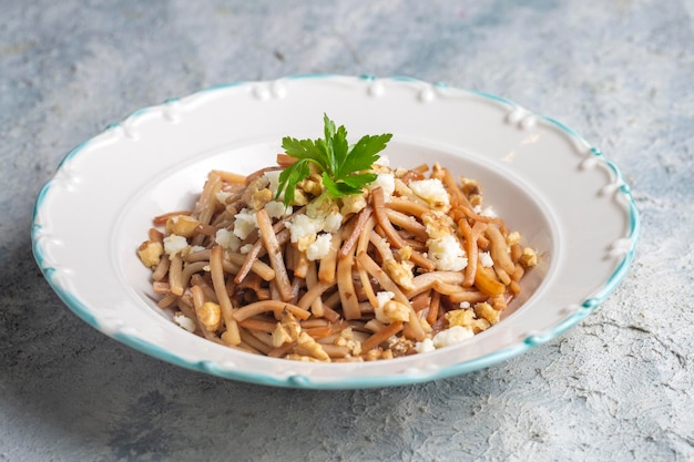 Turkish Noodle - Eriste with cheese, walnuts and parsley.