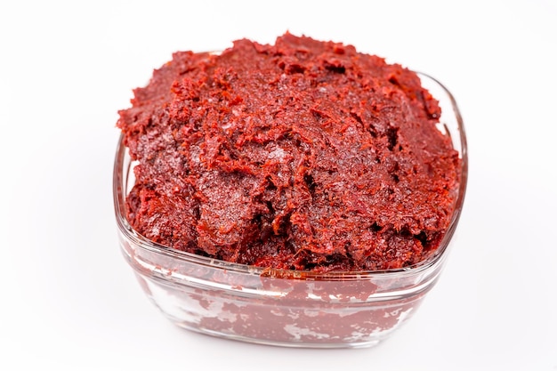 Turkish pepper paste, red pepper (salca) on the white background