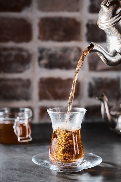 Turkish red aromatic tea in traditional glass