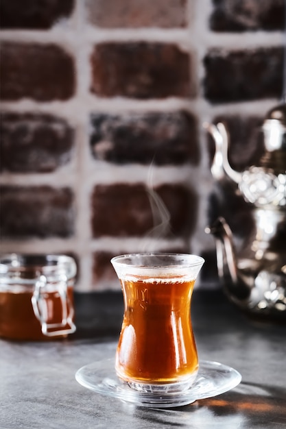 Turkish red aromatic tea in a traditional glass