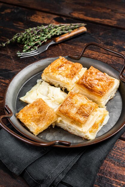 Turkish Su Boregi Tabla borek or Adana Borek with cheese Wooden background Top view