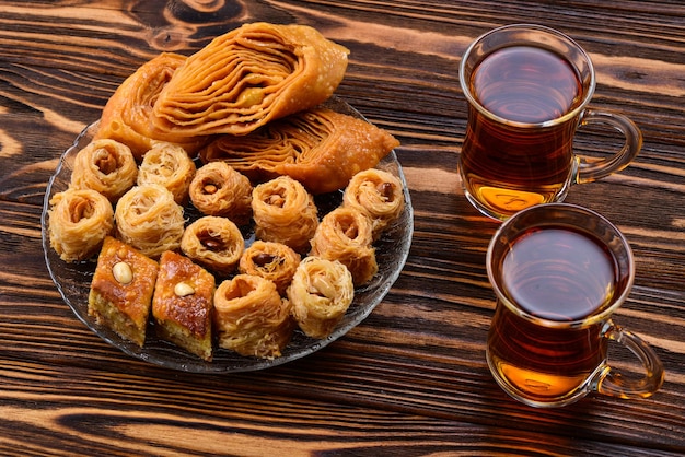 Turkish sweet baklava on plate with Turkish tea