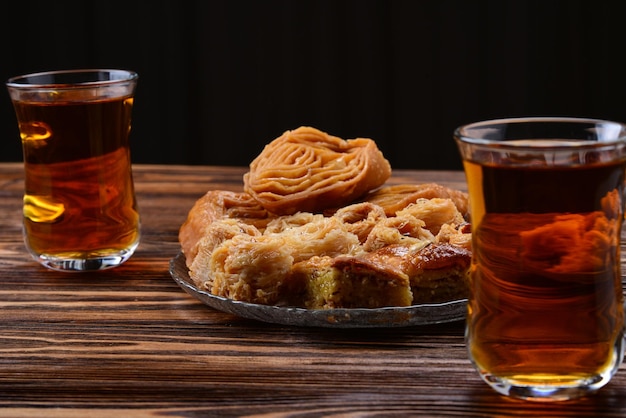 Turkish sweet baklava on plate with Turkish tea