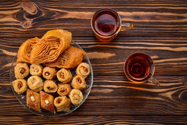 Turkish sweet baklava on plate with Turkish tea