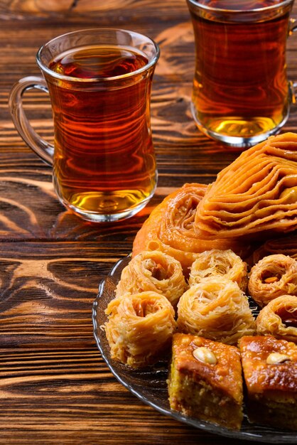 Turkish sweet baklava on plate with turkish tea