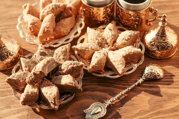 Turkish sweets with coffee on a wooden table